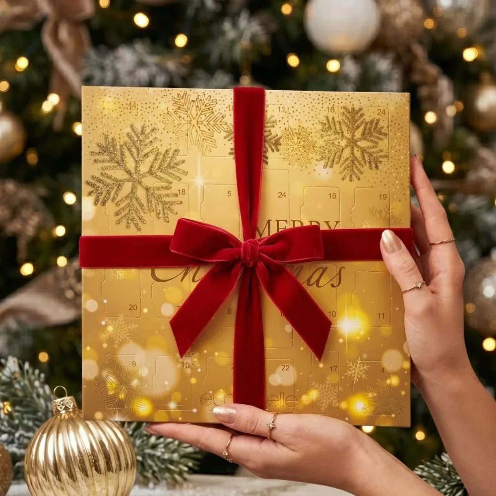 être belle Ampullen-Adventskalender 2026 in Gold mit roter Samtschleife